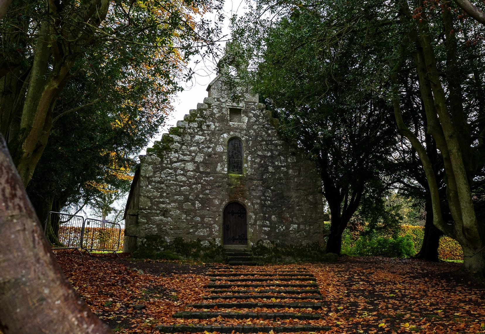 Drum Castle chapel in the midst of trees