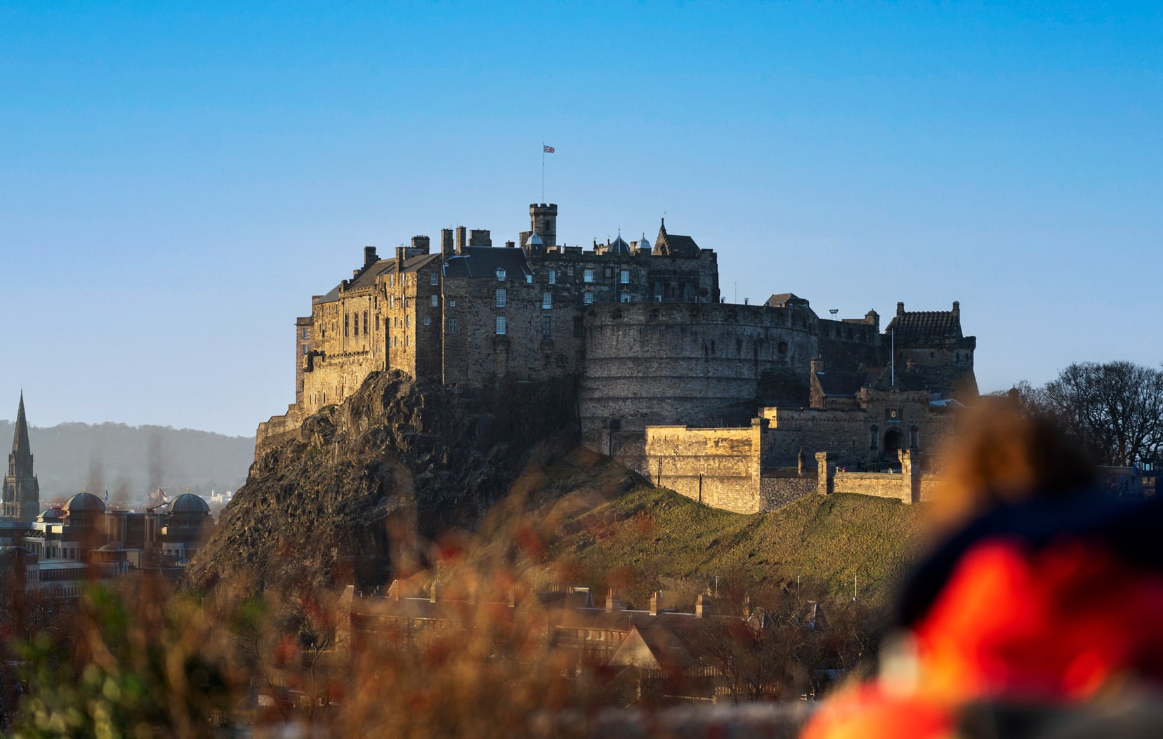 Edinburgh Castle perched on the edge of the rocky edge