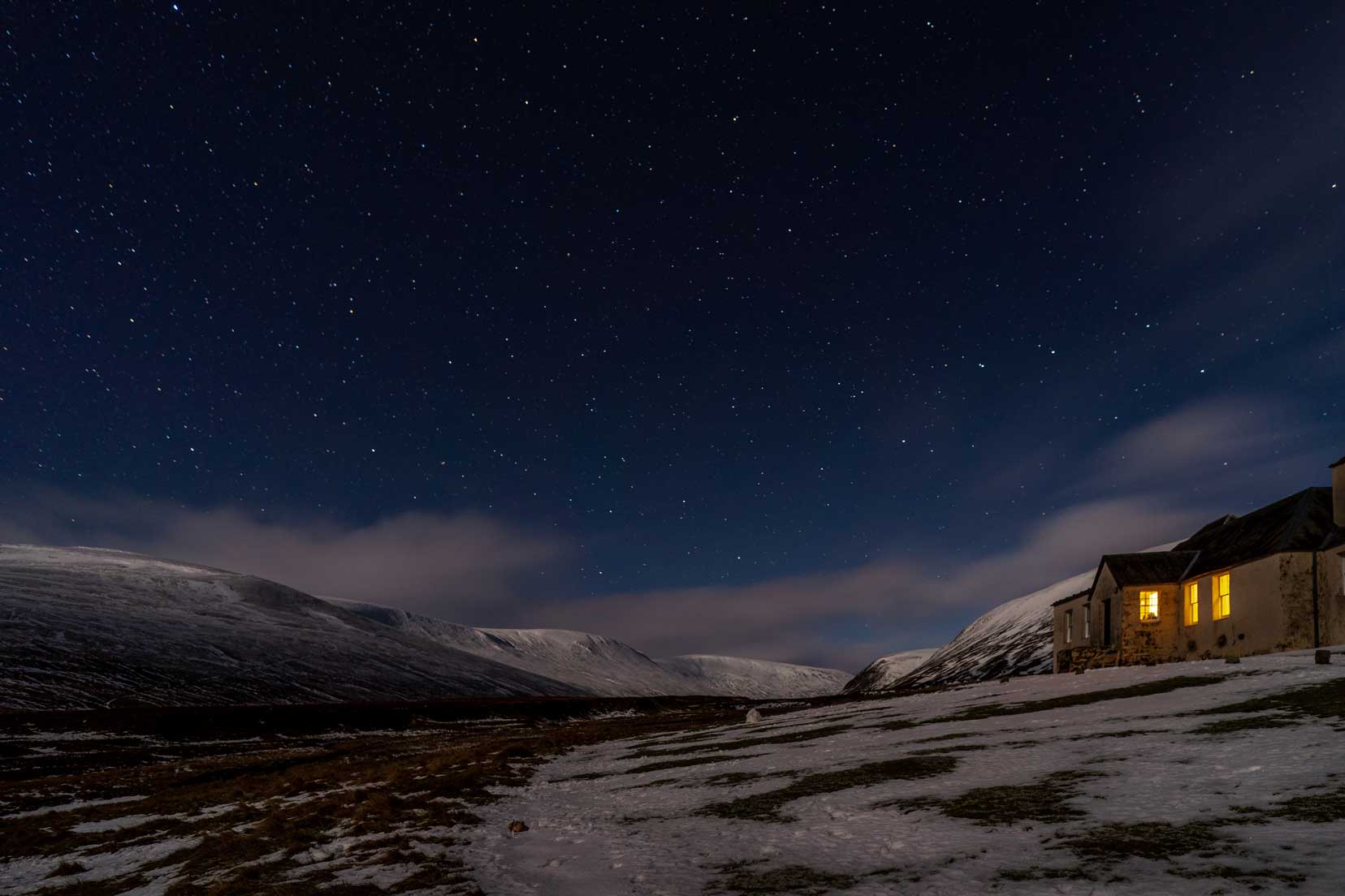 Bruar-Lodge,Cairngorms night shot with snowy mountain backdrop