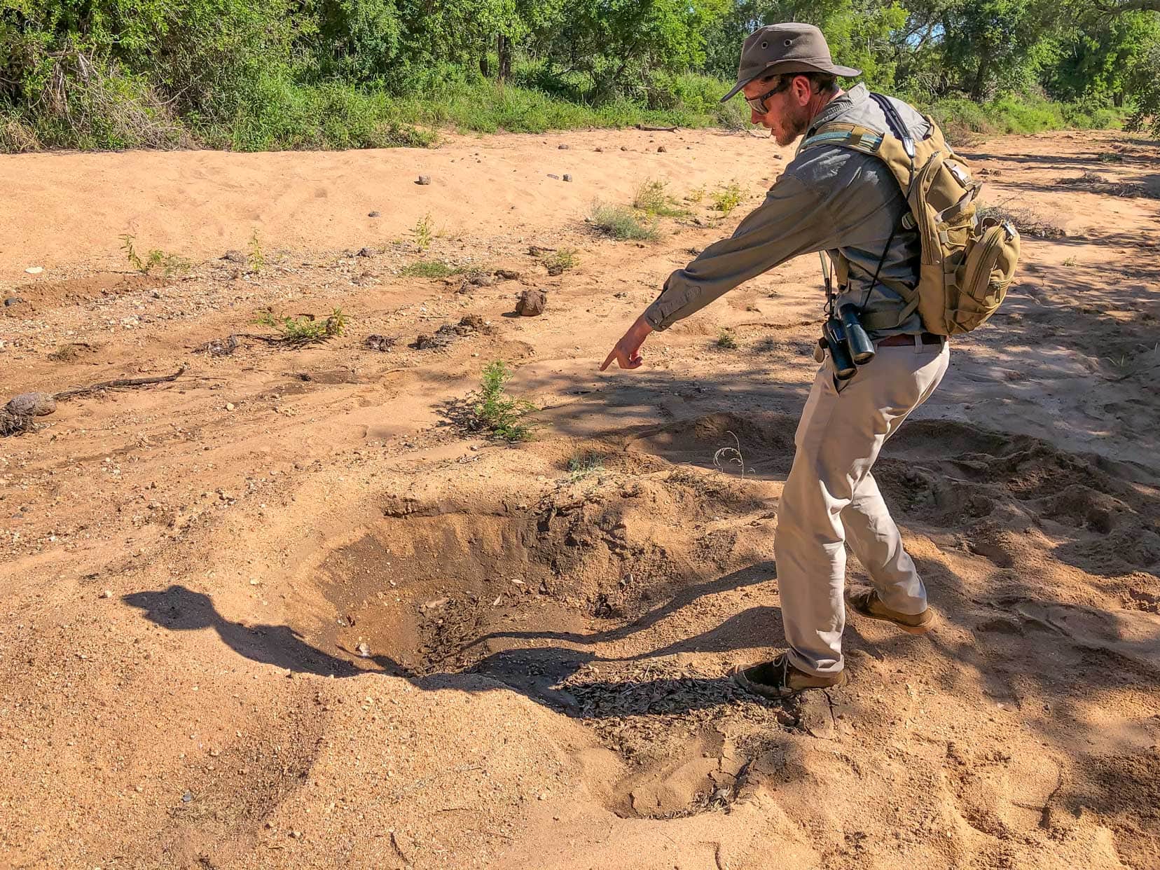 Large indent in the sand showing the resting place of a rhino