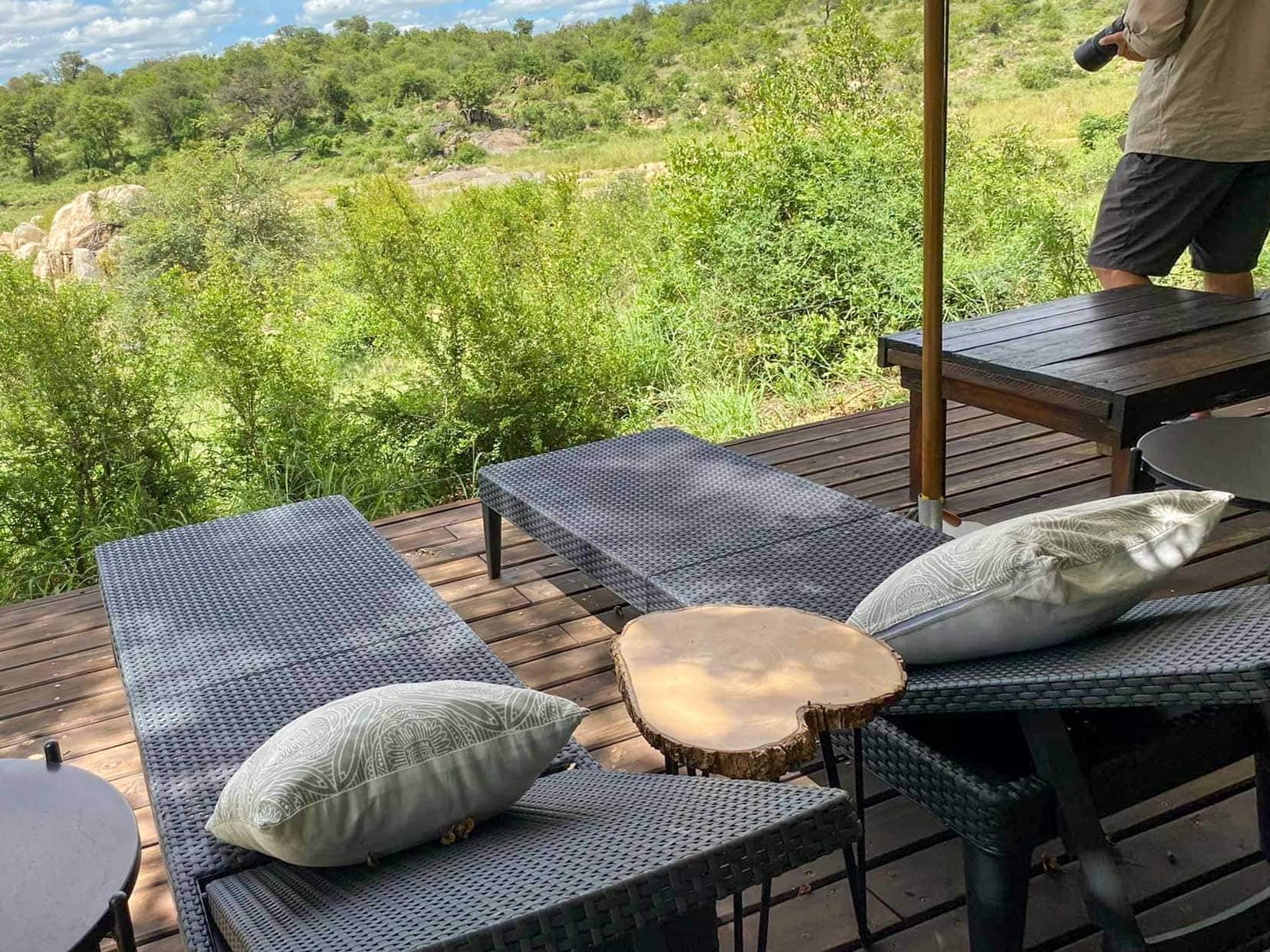 sunbeds on wooden decking overlooking Klaserie River