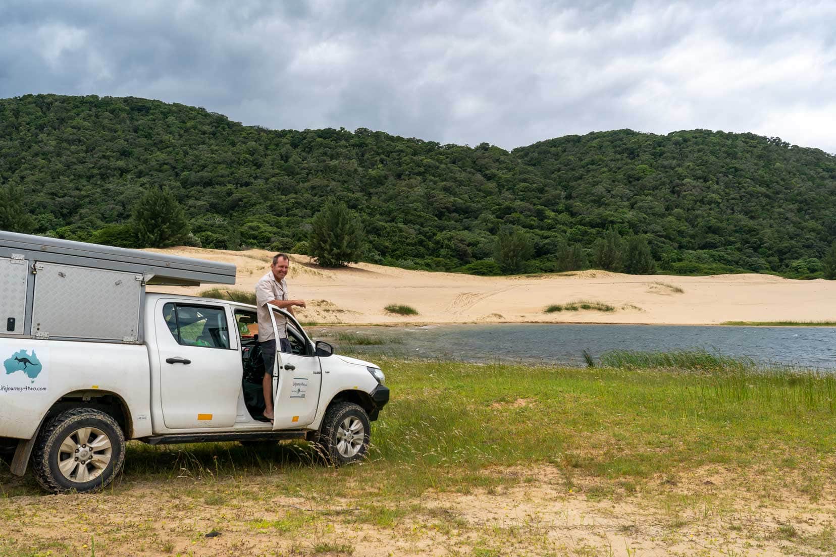 Lake Sibaya_iSimangaliso wetlands Lars stood on side of hilux 4x4 camper