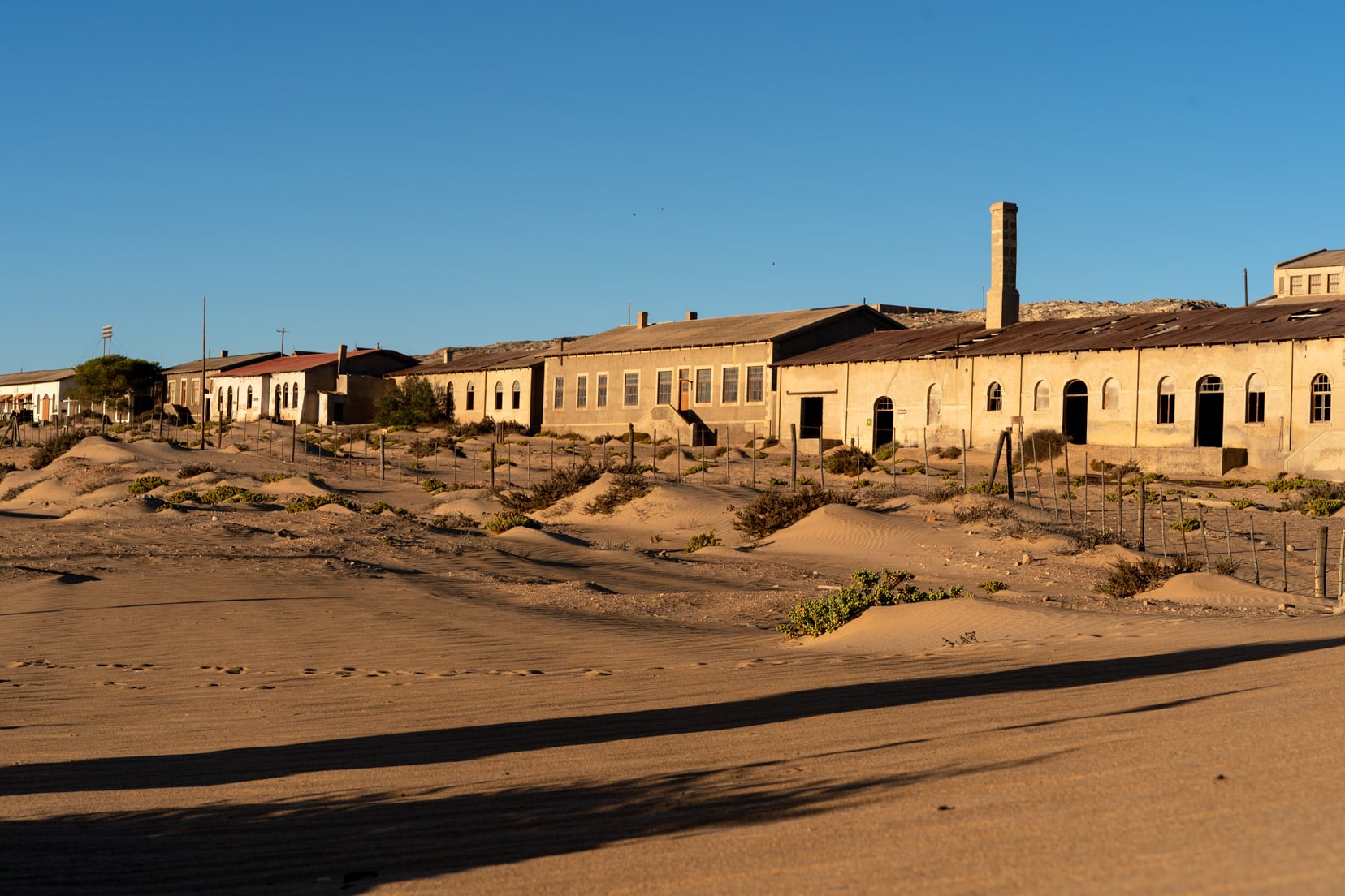 Kolmanskop old buildings with the sun shining on them