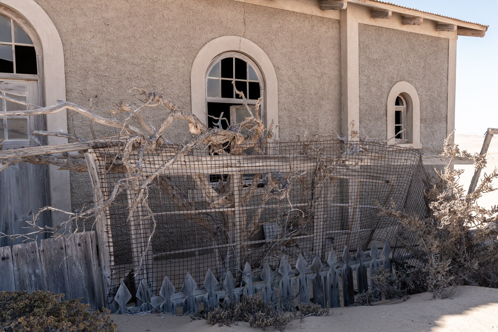 half-buried-picket-fence at Kolmanskop ghost town