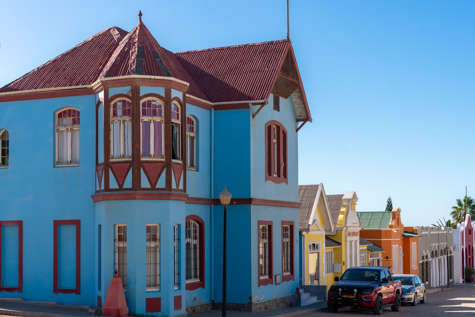 red-blue-house-near-church