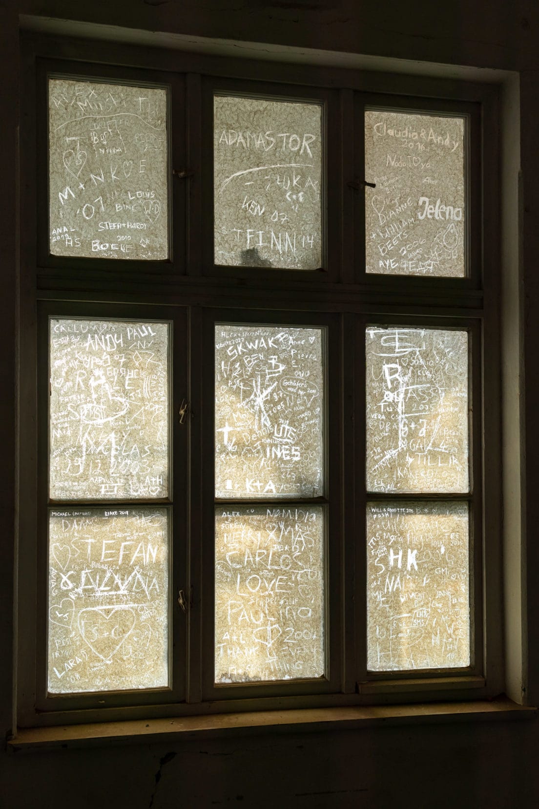 window with scratches on in the kolmanskop hospital