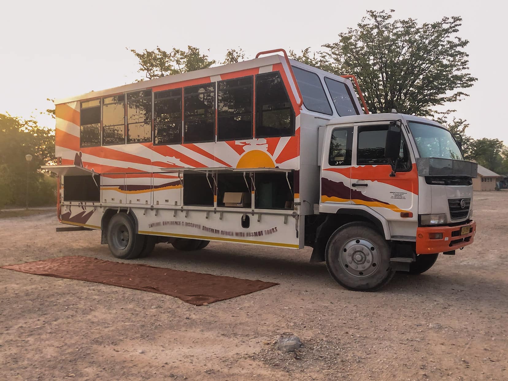 Safari tour truck with enclosed viewing on the back of the truck 