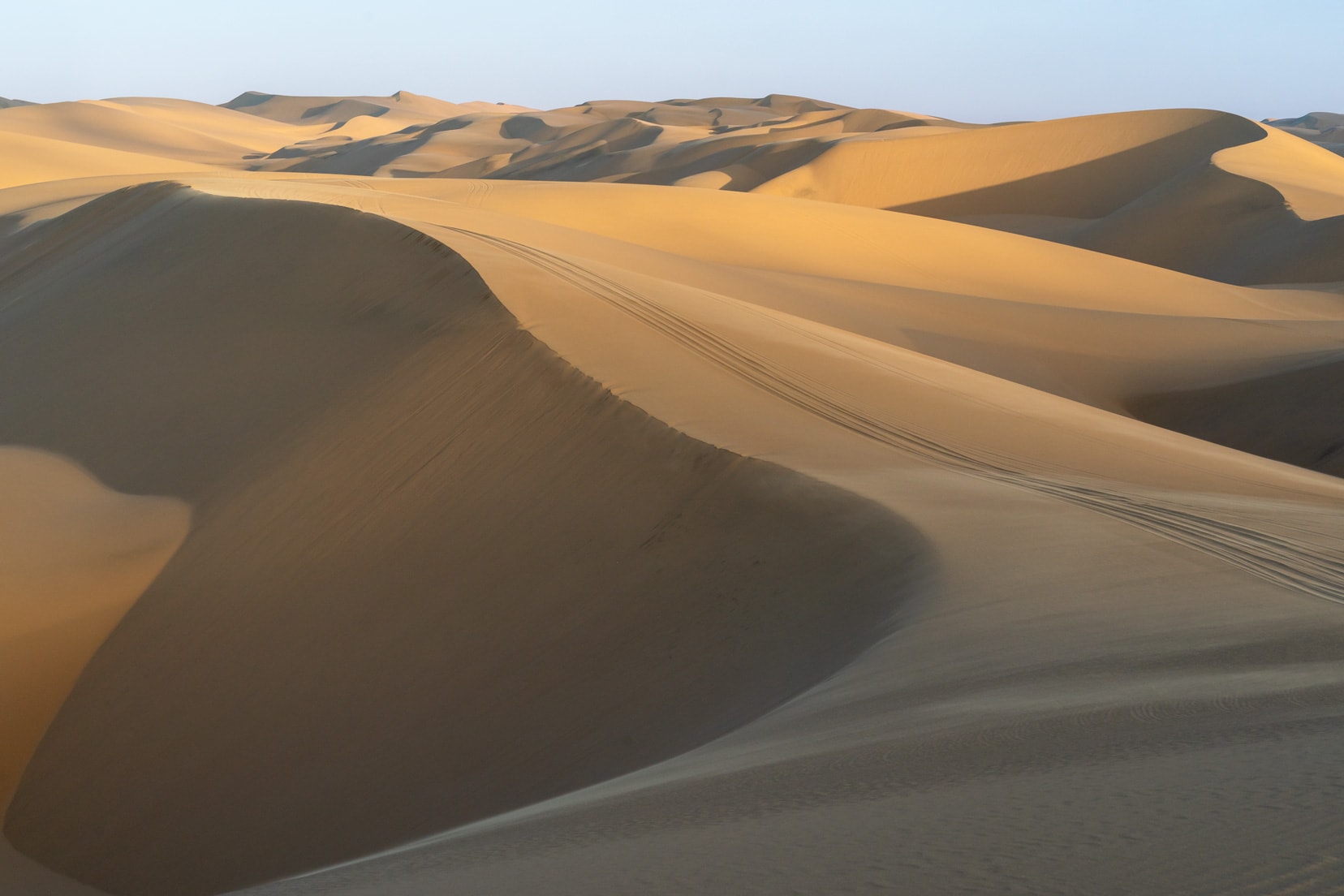 Dunes-with-vehicle tracks_across
