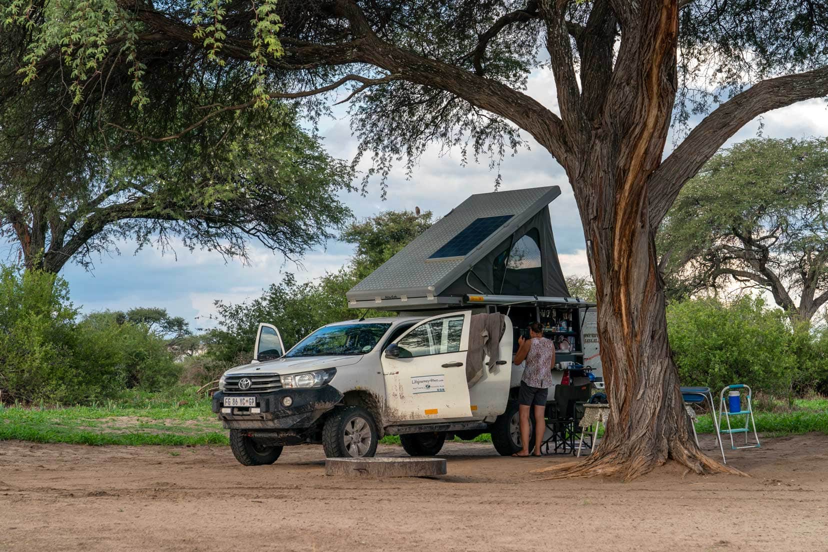 Makgadikgadi Camping - our 4x4 camper with roof top tent popped up under a large tree