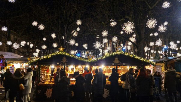 Basel Christmas Market stalls with people milling around