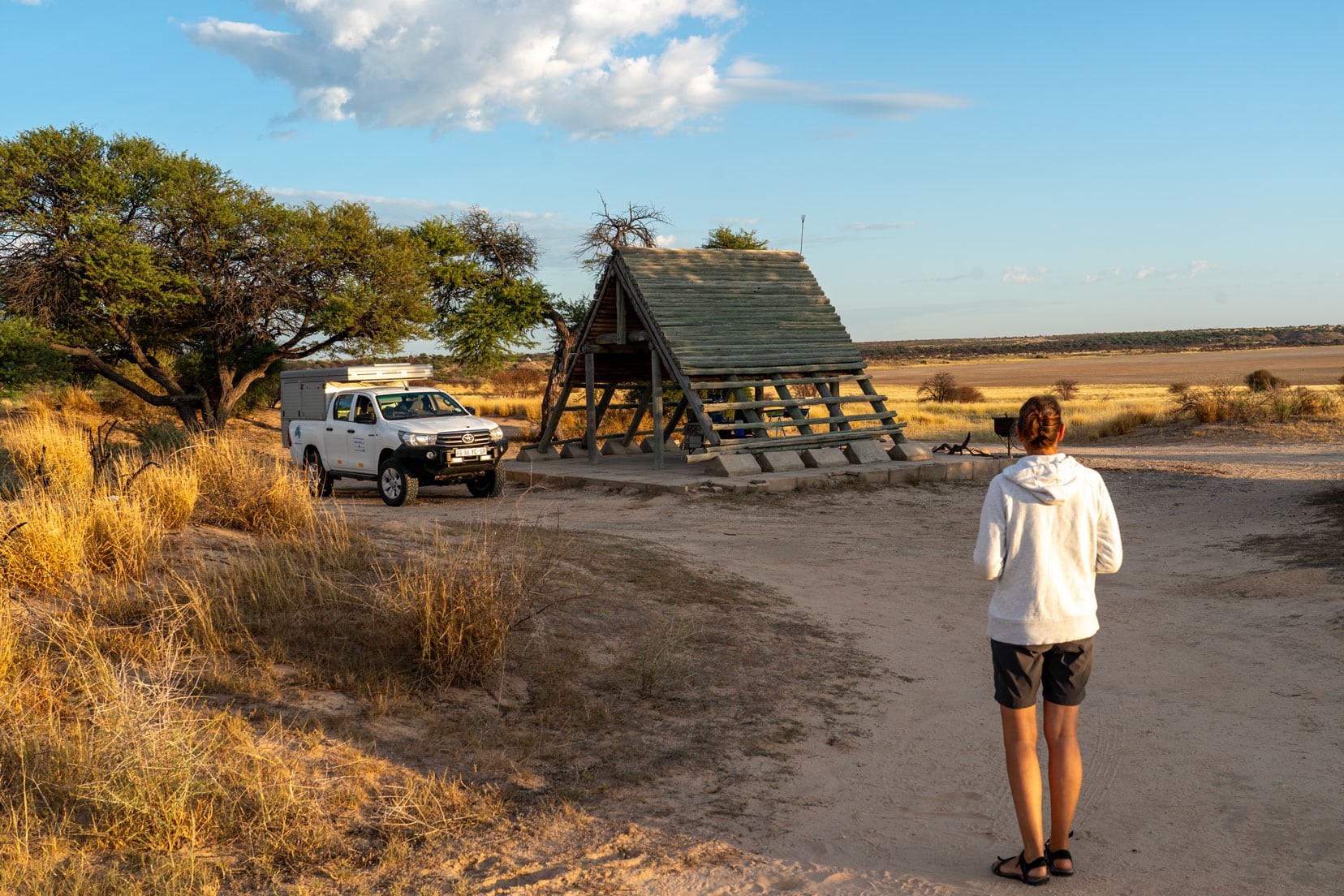 Camping in the Kgalagadi  with an A-Frame shelter beside the camper