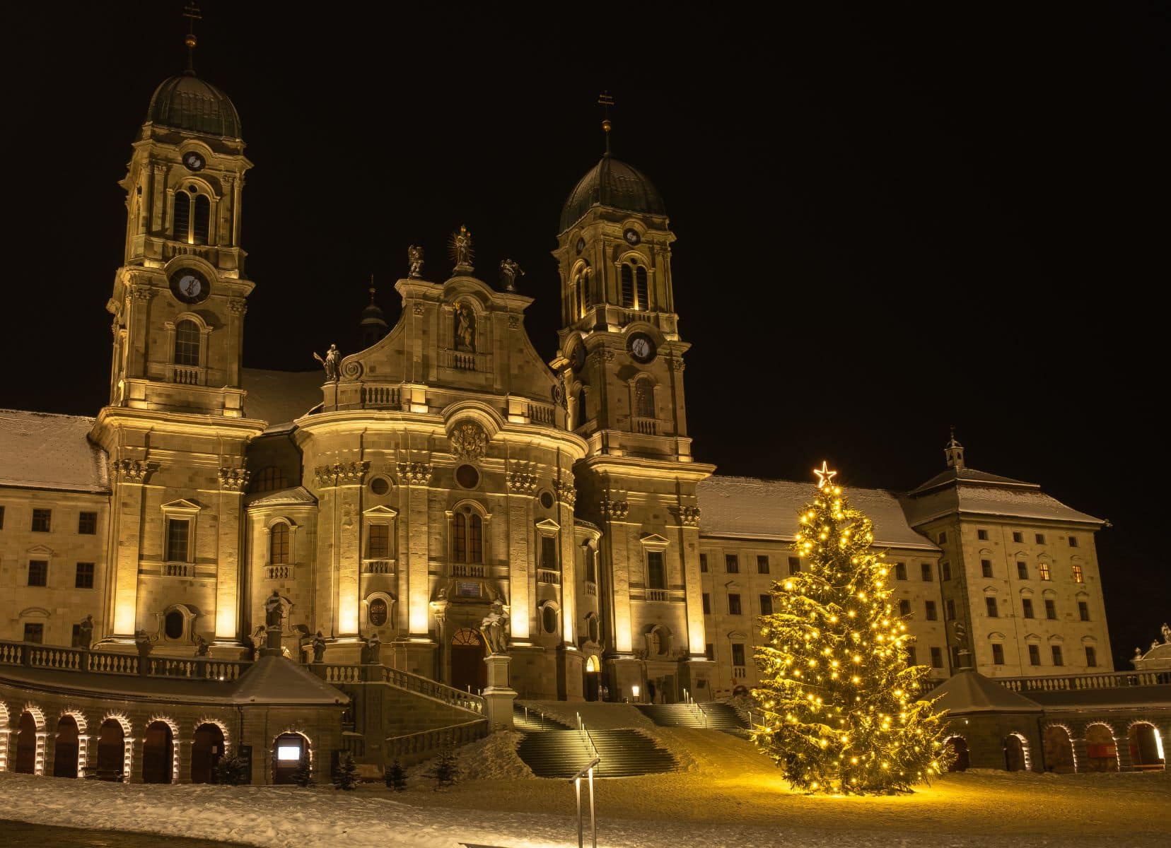 Einsiedeln Abbey with a Christmas tree in front of it.