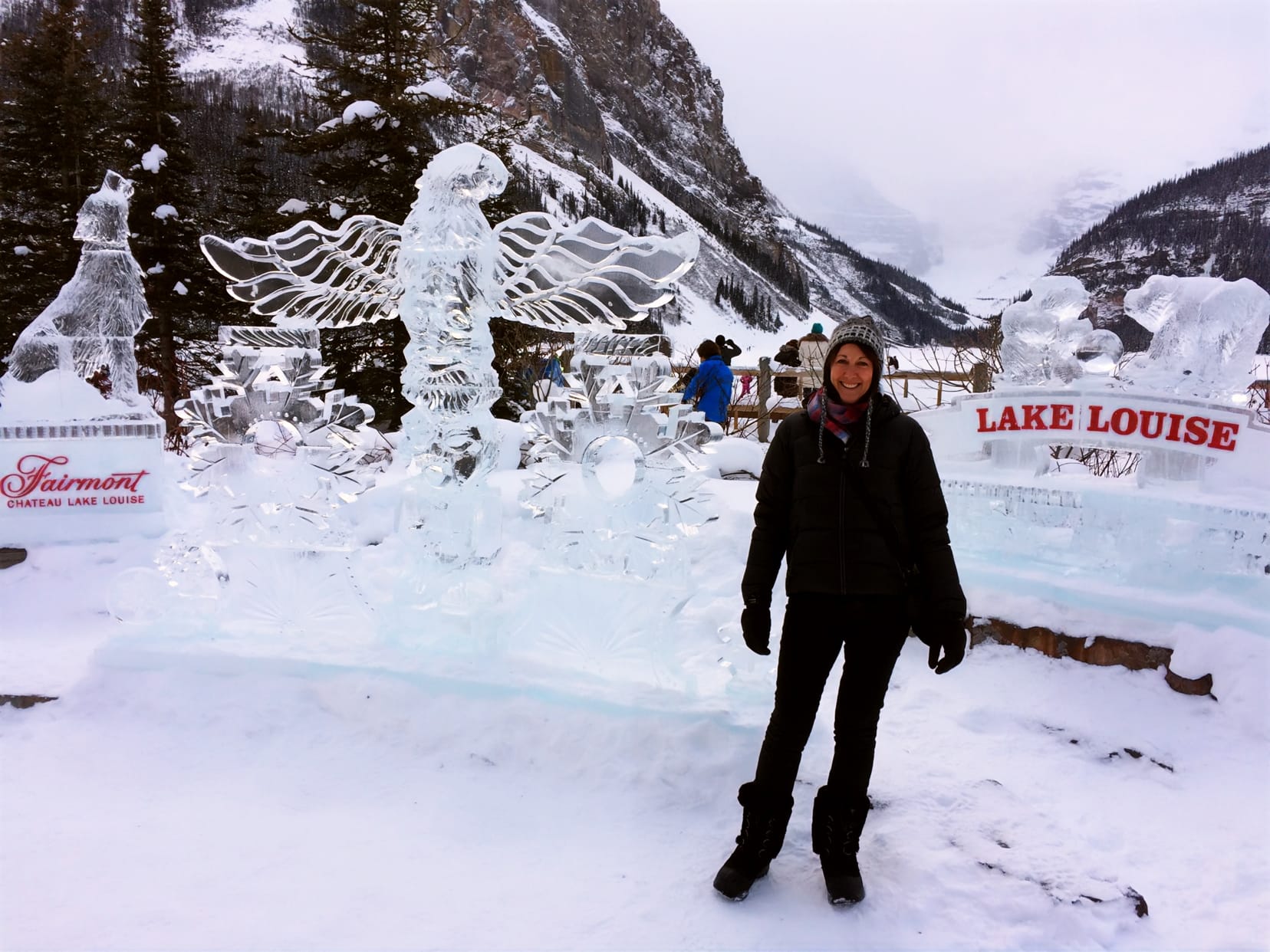 Shelley at Lake louise beside ice sculptures