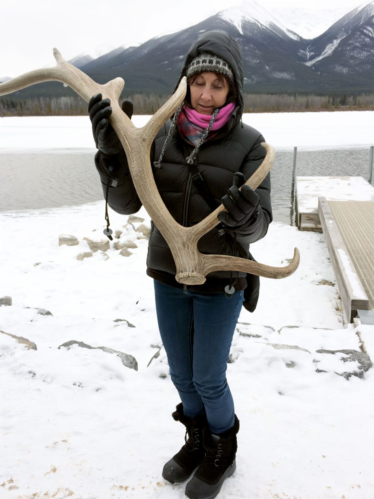 Shelley holding an elk antler on the Winter wildlife tour in Banff