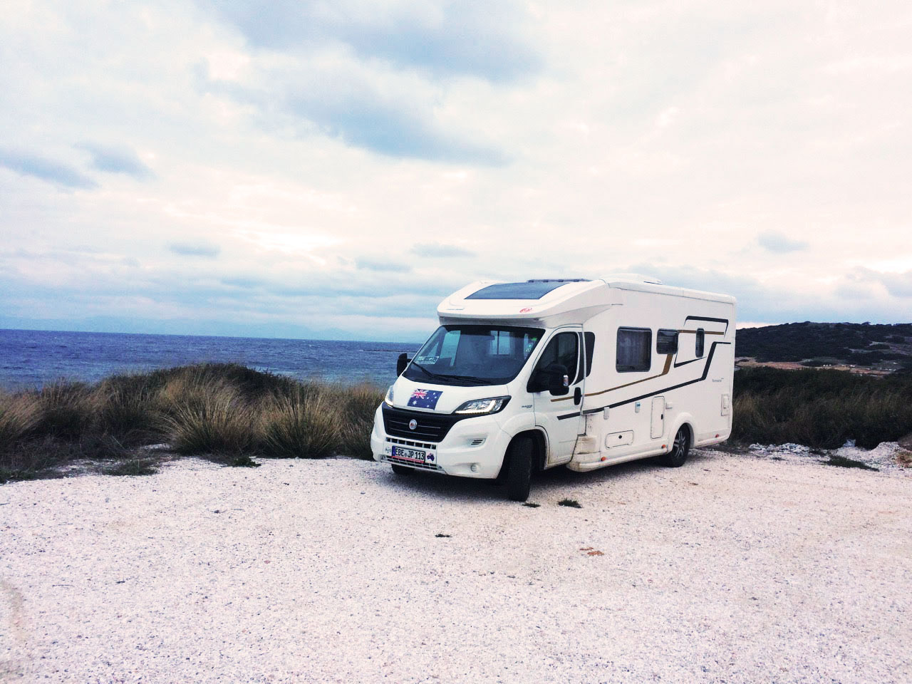 Our motorhome parked by the water in Greece