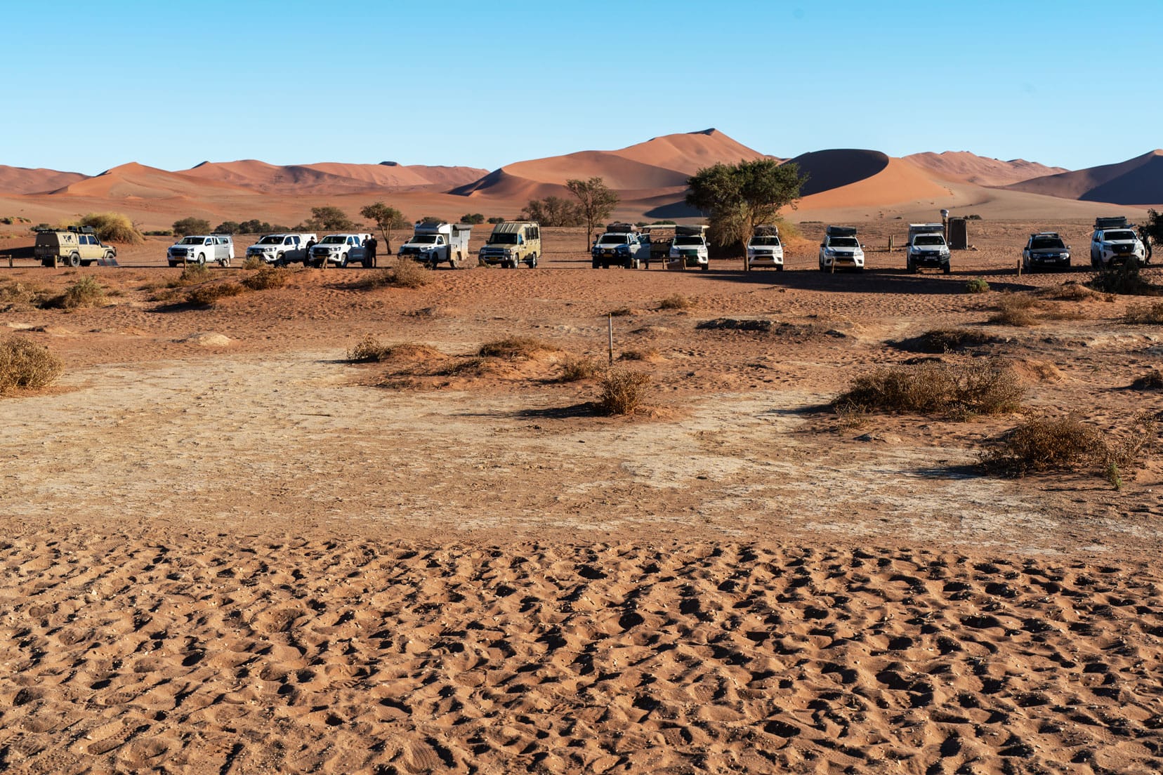 Sossusvlei-carpark-later with lots of 4x4 cars 