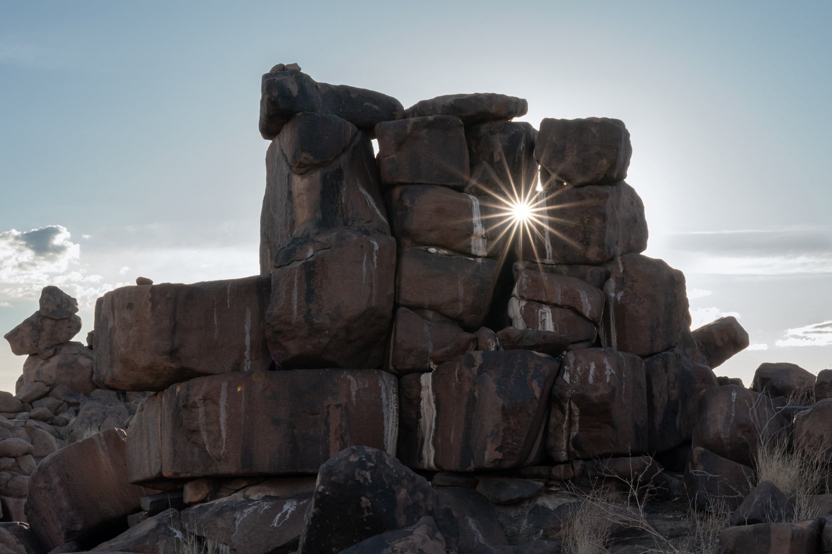 Sun flare peeping through the rock formations