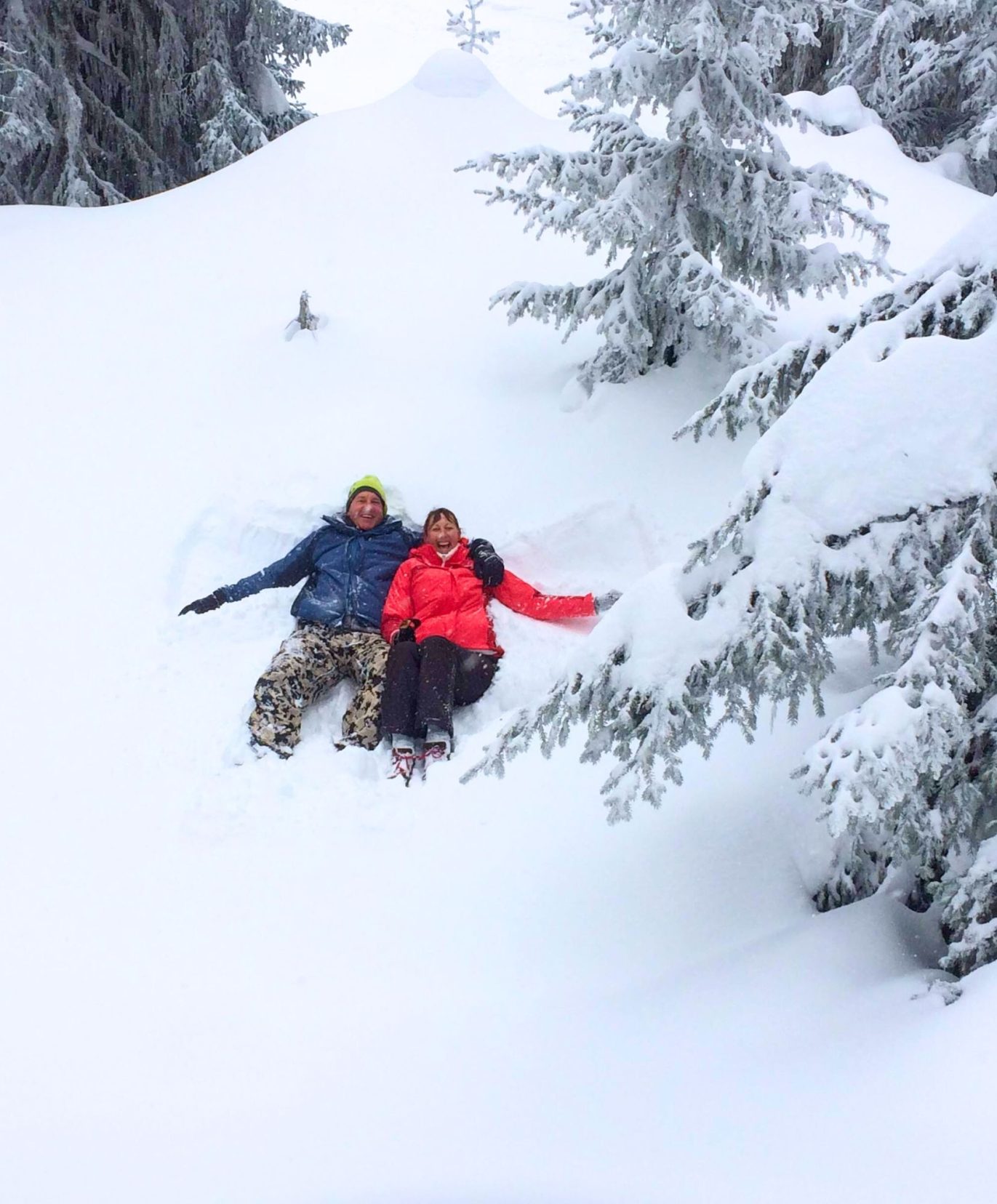 Lars and Shelley making snow angels in the snow 