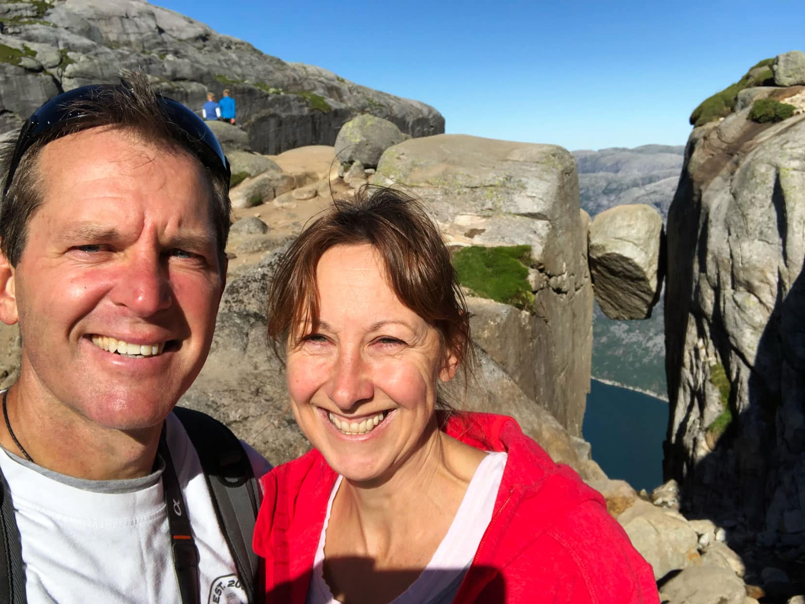 Lars and Shelley stood near the boulder wedged between two cliffs at Kjeragbolten