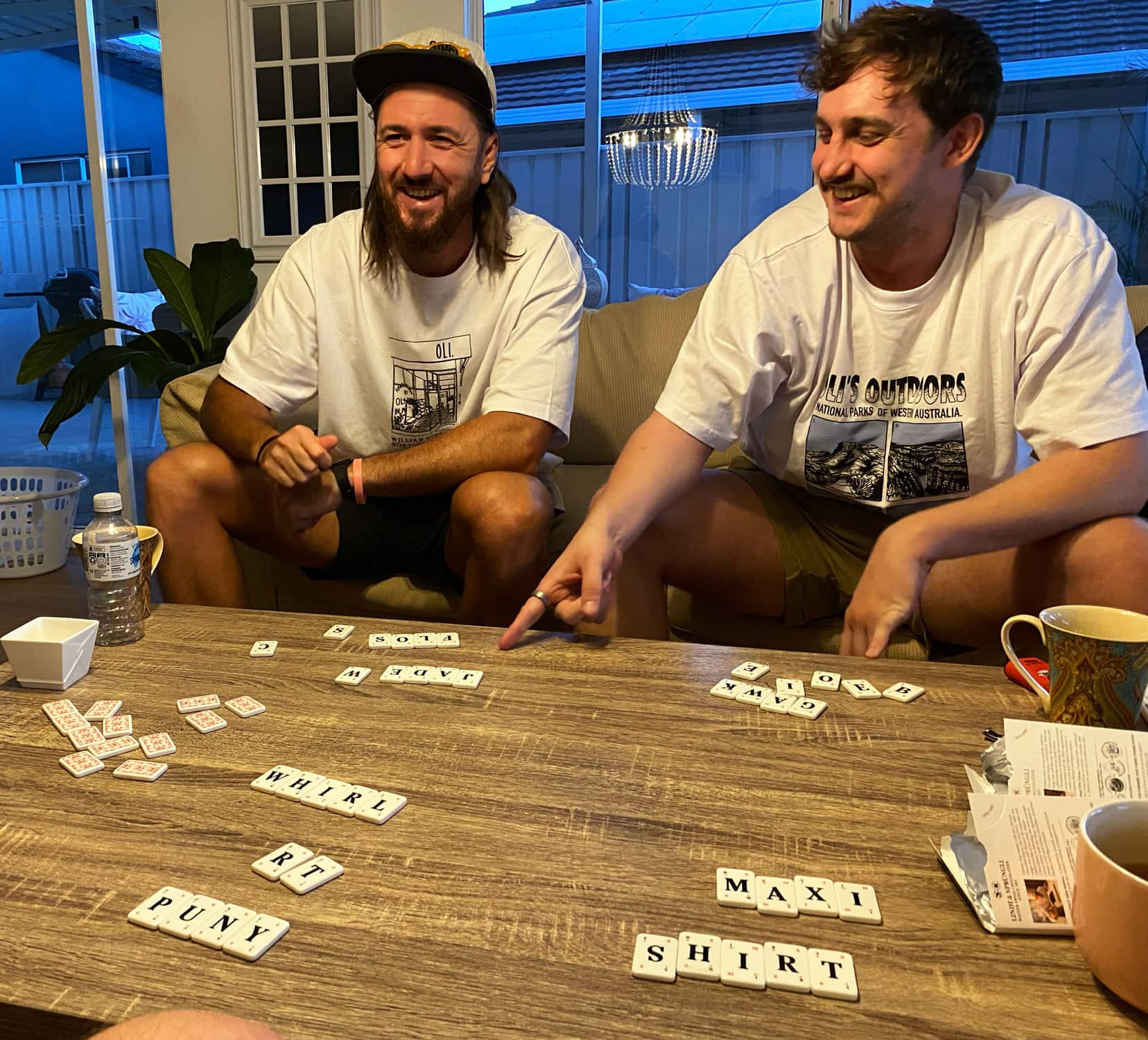 Playing Lexicon go with my three sons with the letter tiles on the table forming words