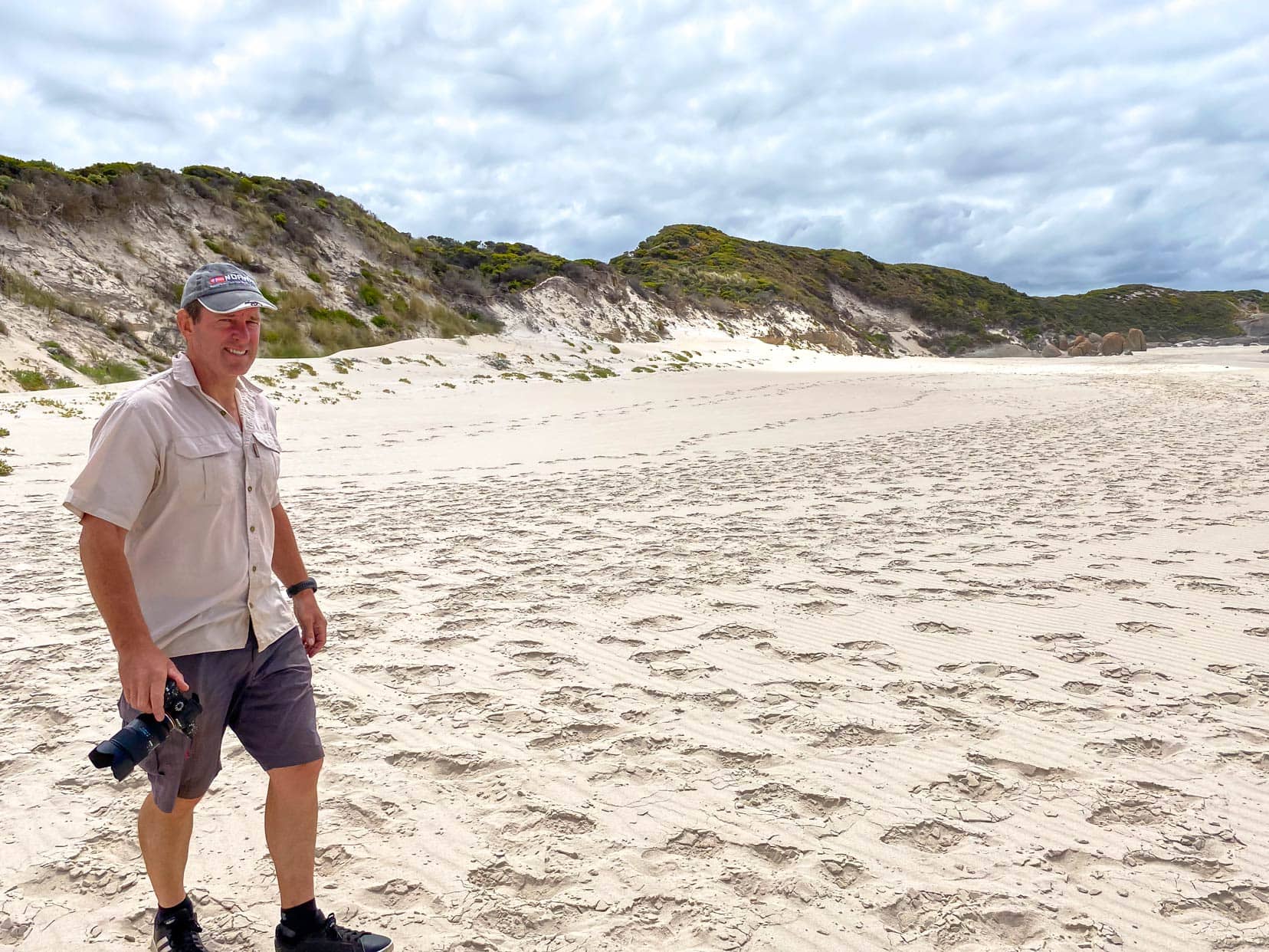 Lars stood on Shelly Beach Walpole with camera in hand