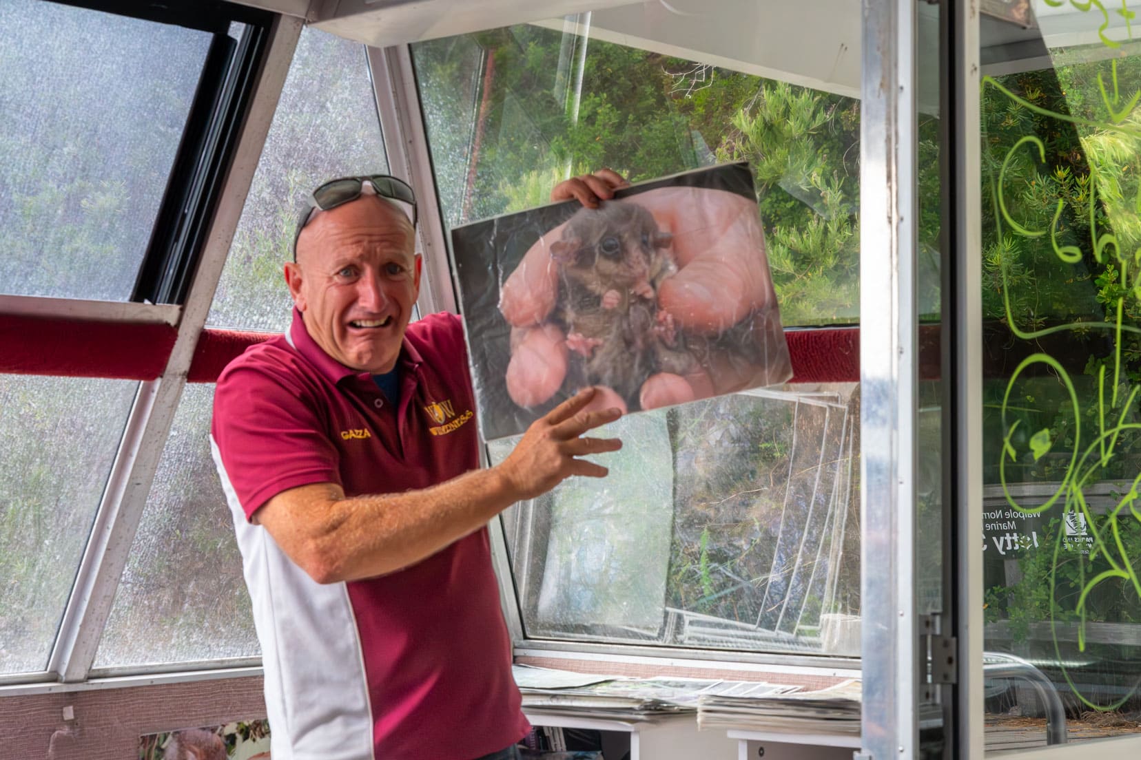 Gary showing us the photo of a honey possum - which fits in the palm of a hand