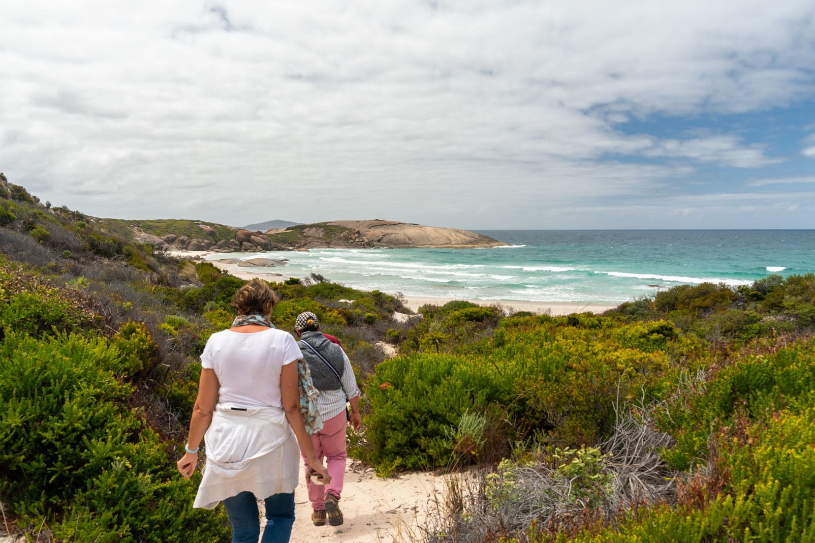 Small hike to Shelly Beach with Gary leading the way and a view ot turquoise bay and rocky promontory