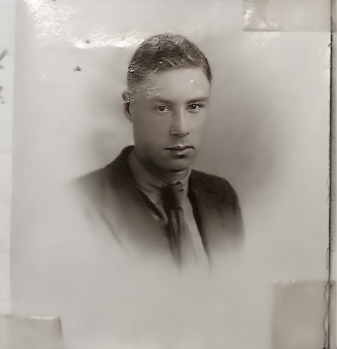 My grandfather at age 16 wearing a  jacket and tie