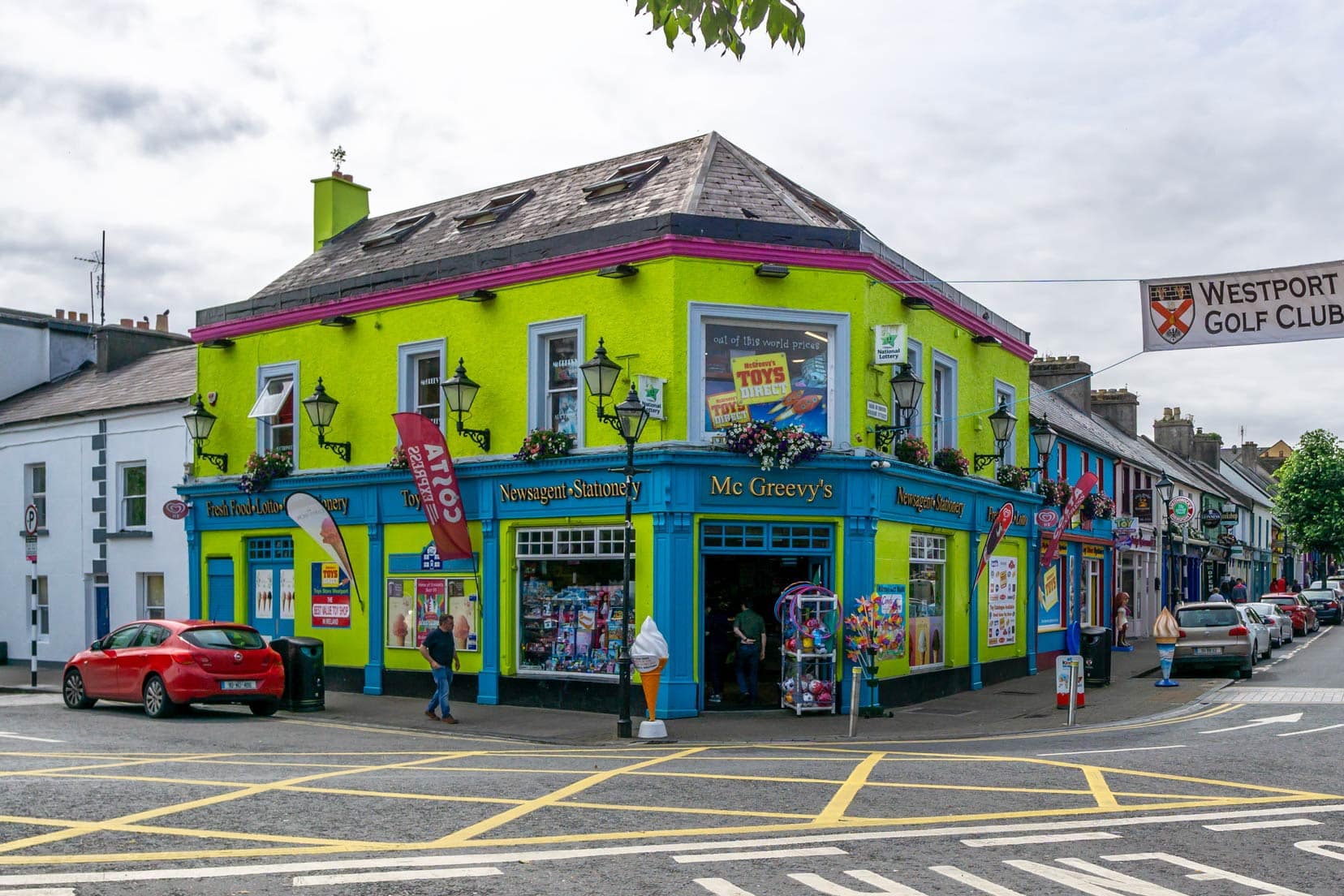 Mcgreeveys corner store - a bright green building