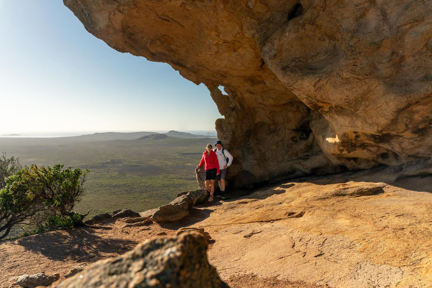 Lars and shelley stood at the entrance to the cave on Frenchman Peak