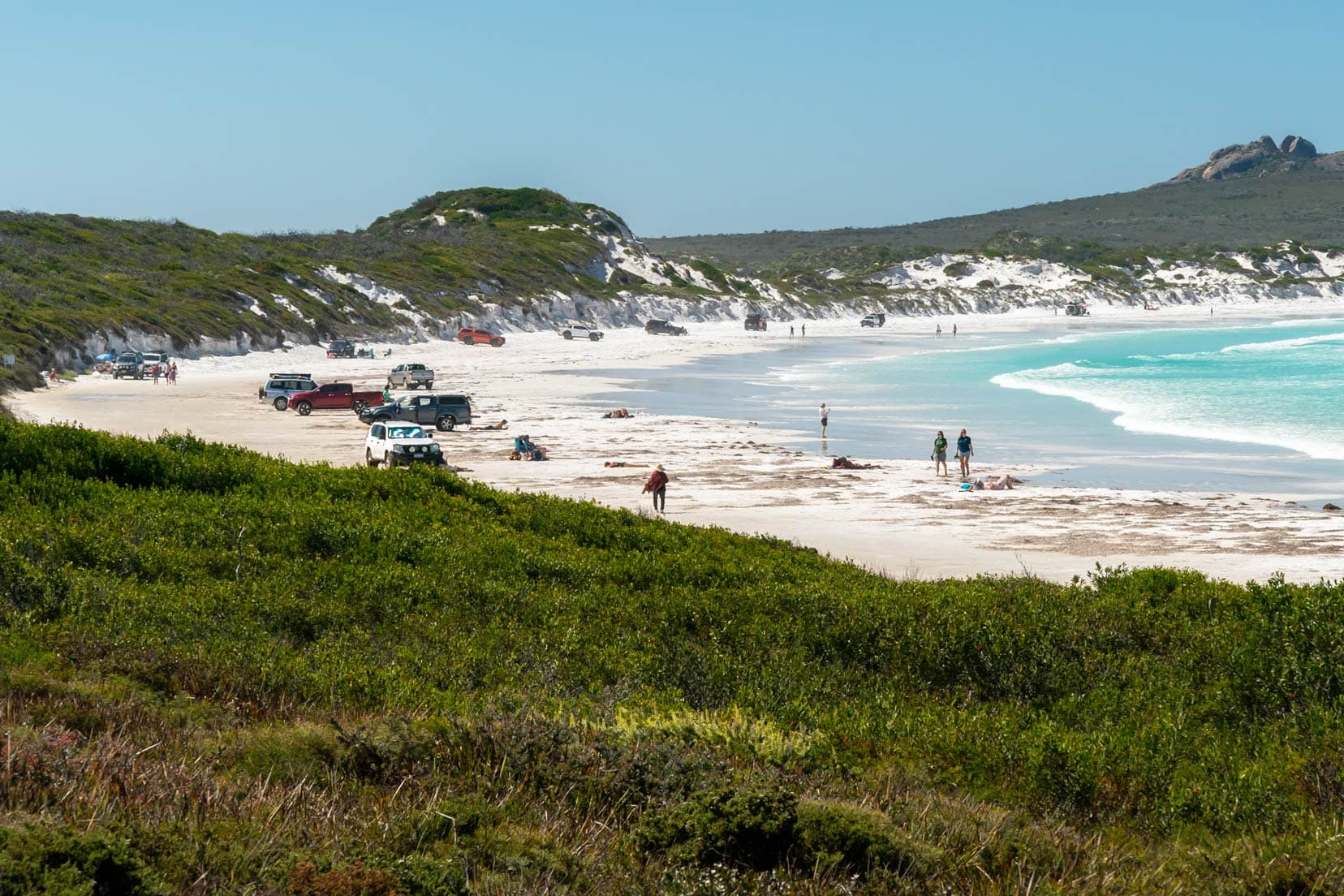 4x4 vehicles on the white sands of lucky bay