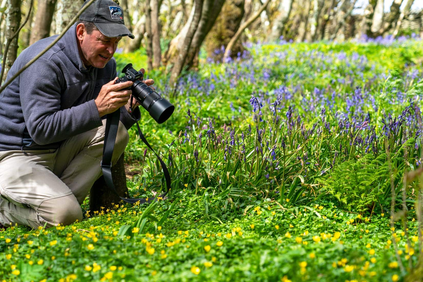 Lars taking photos of bluebells in spring in orkney