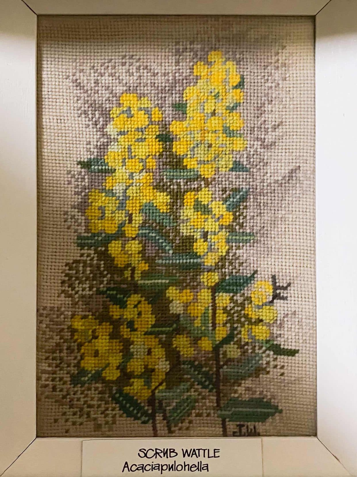 Cross stitch picture of yellow flowers