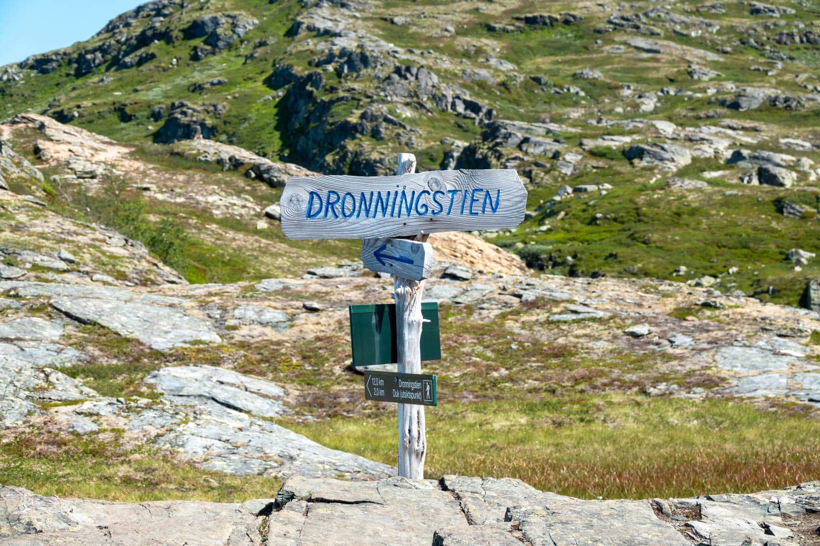 Dronningstein sign on the craggy ground of the mountain 