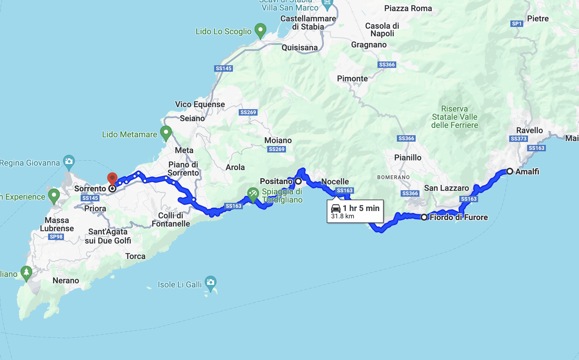 The Amalfi Coast winding coastal road with colorful houses and deep blue sea
