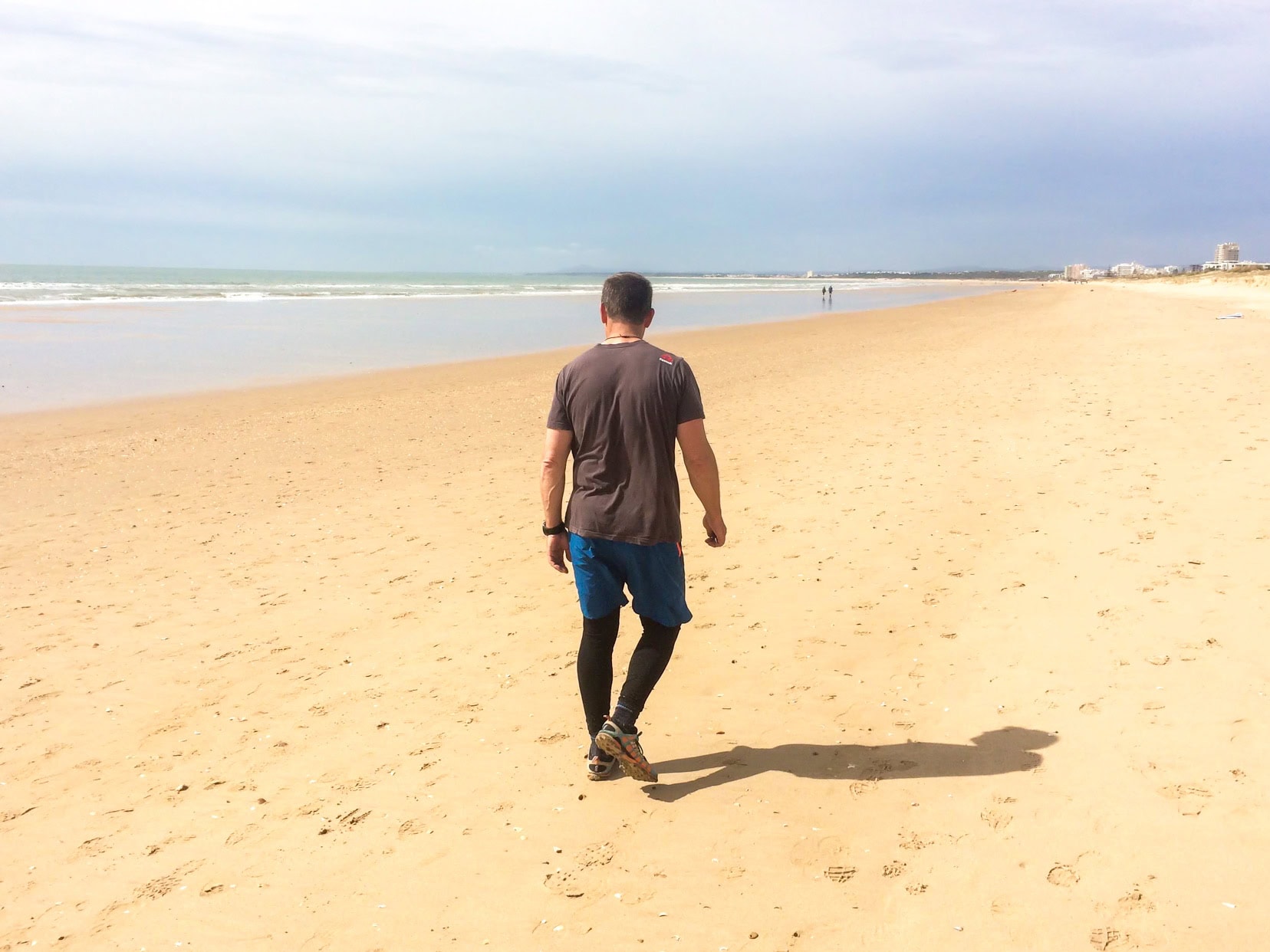 Lars walking along Monte Gordo Beach, on the Algarve in mid-March