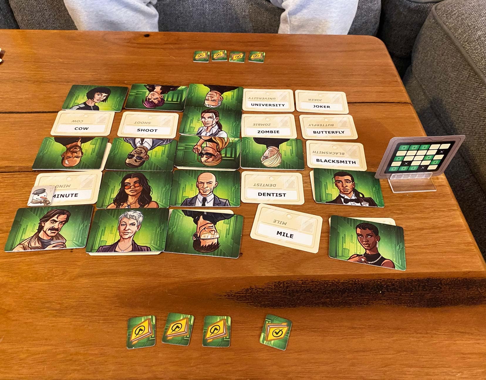 Codenames-Duet-play set up with the words covered by green cards