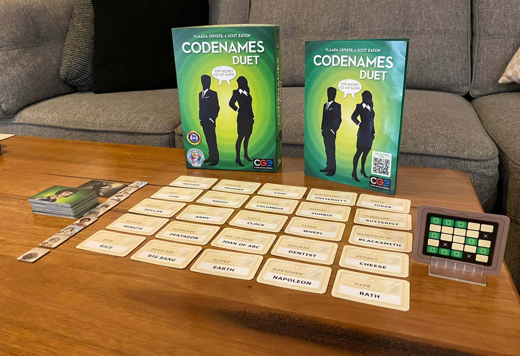 Codenames Duet Game set up on a table with 25 word cards 