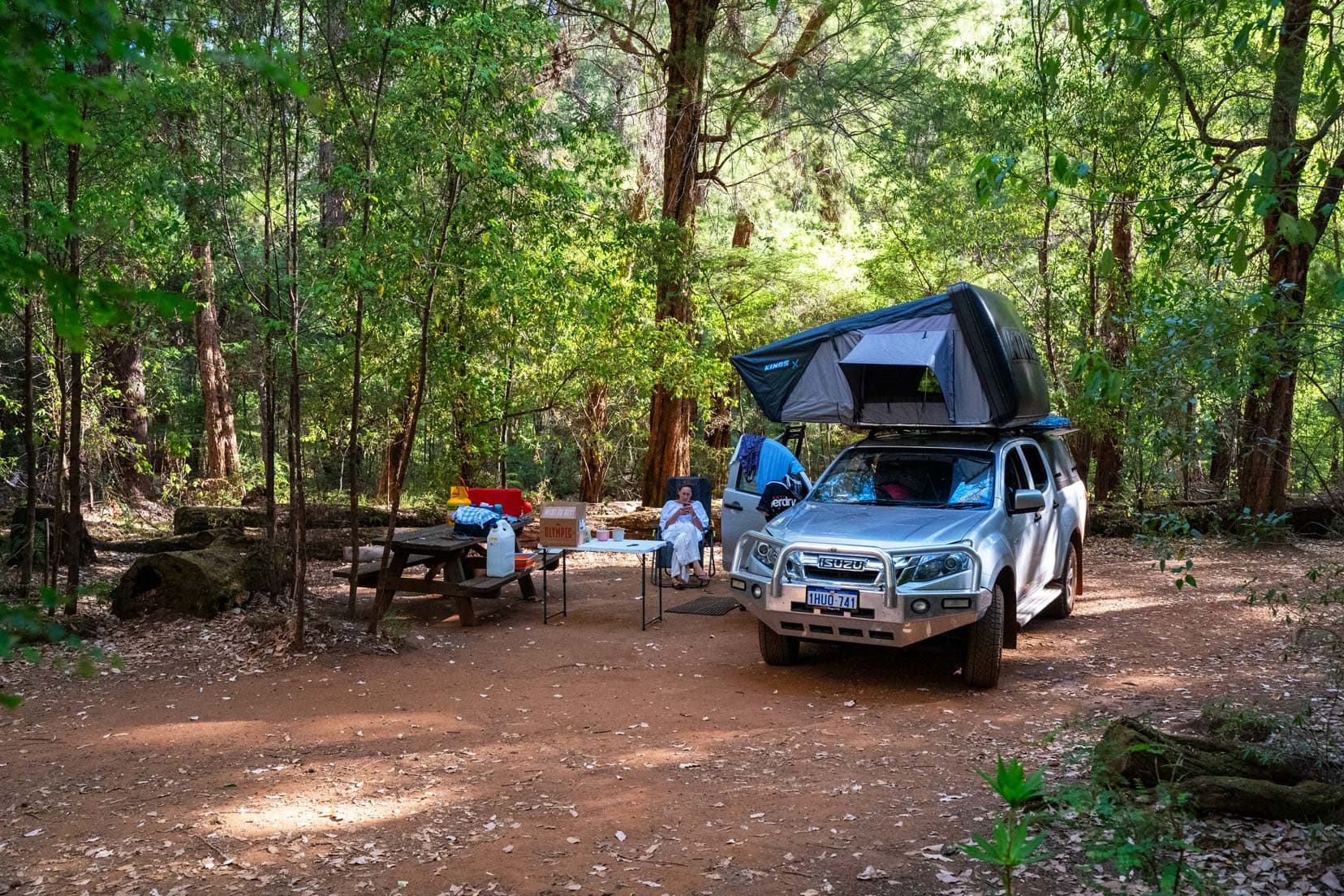 Our 4x4 parked at Draftys Camp on the Heartbreak Trail with roof top tent under the trees