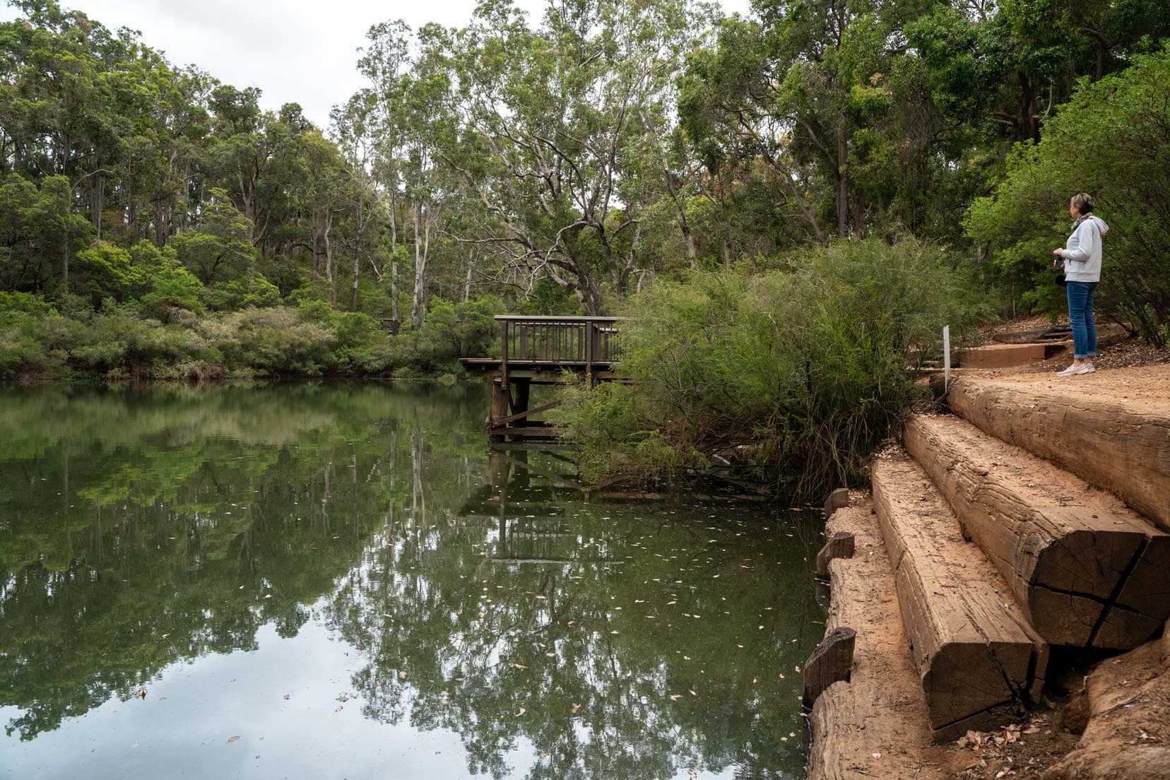 Perth-to-Esperance-Road-trip-barrabup-Pool- shelley stood looking at the river surrounded by tall trees