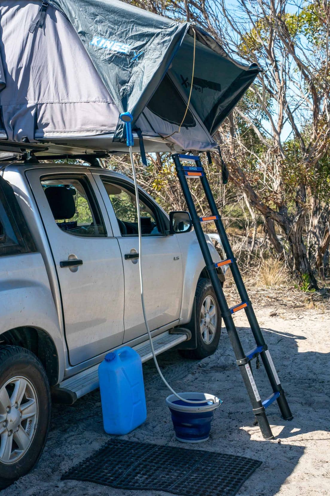 Camp-shower-attached-to-roof top tent