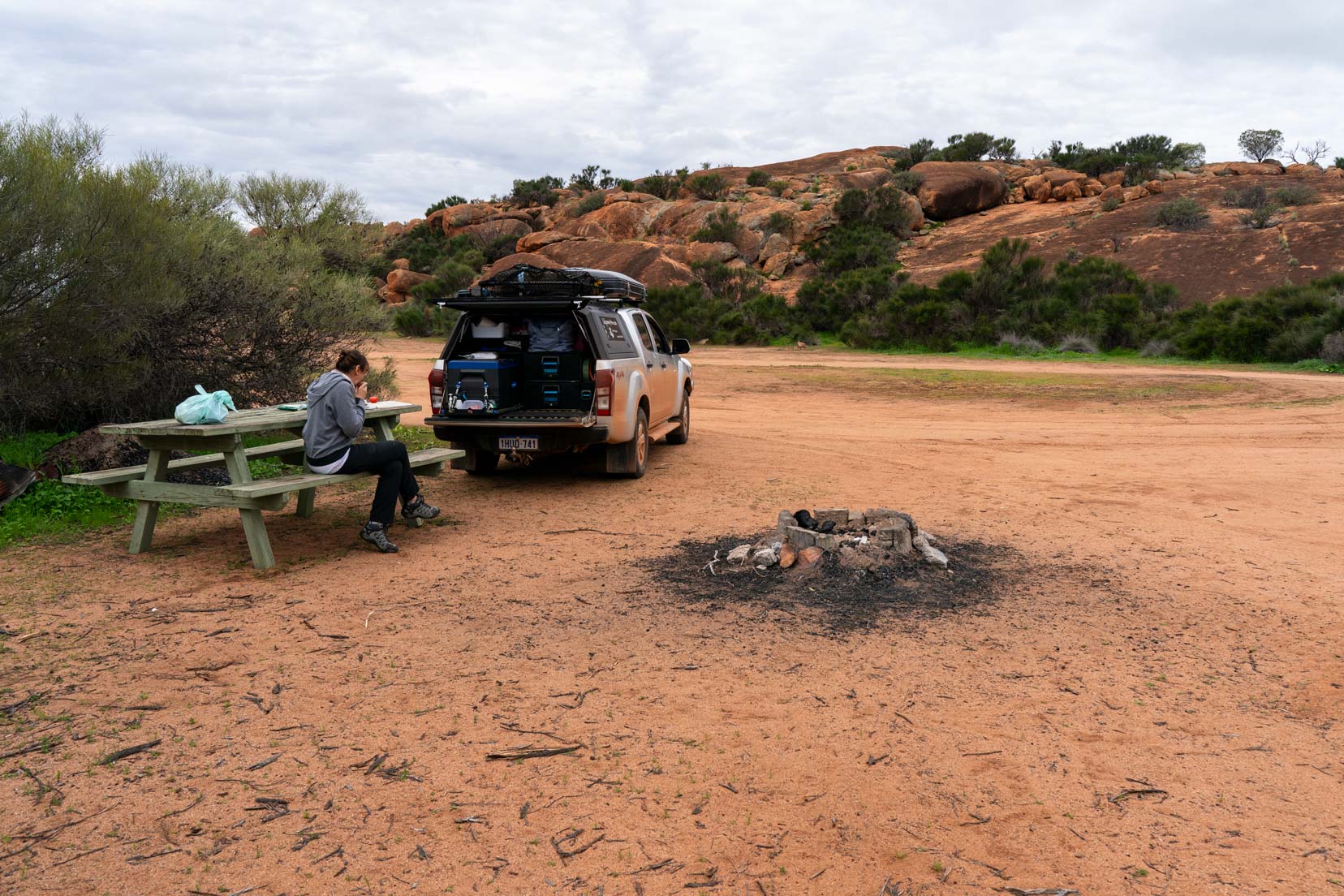 Bilburning-rock shelley sat by car o picnic table bench with a granite rock in the background