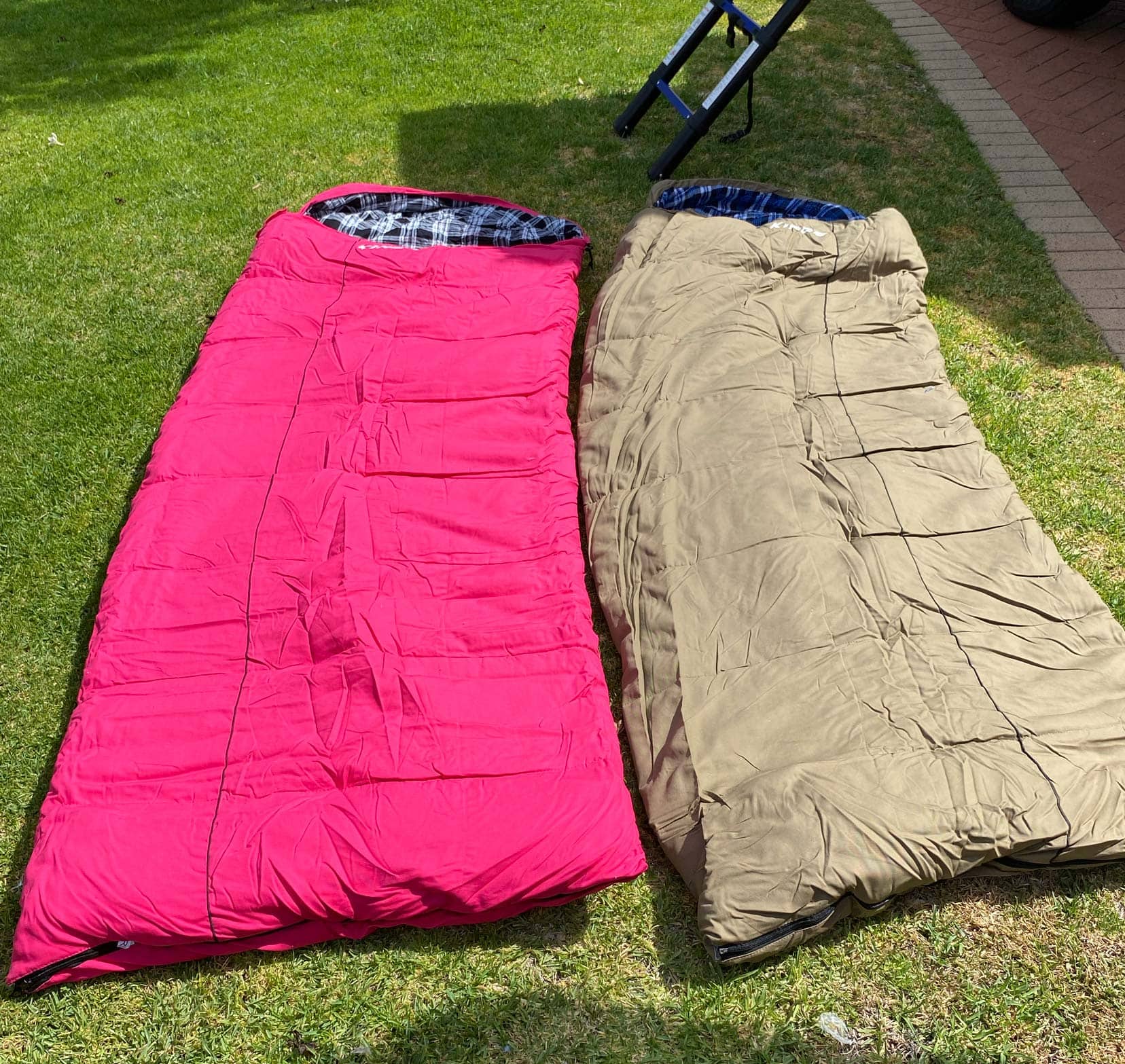 Camping in WA two sleeping bags one pink one beige