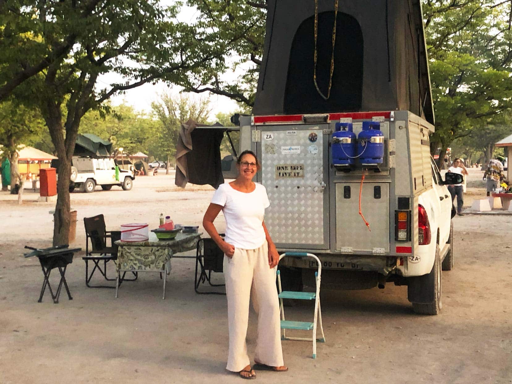 Shelley stood by camper in Etosha